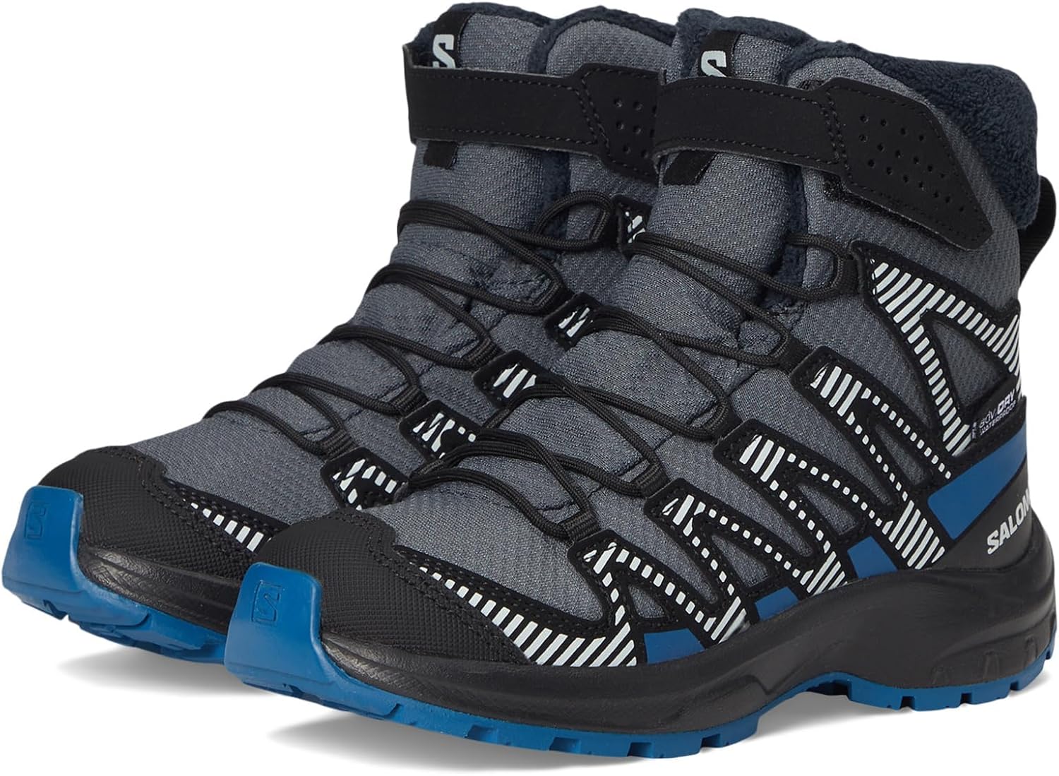 Salomon kids trail running shoes on a rocky path