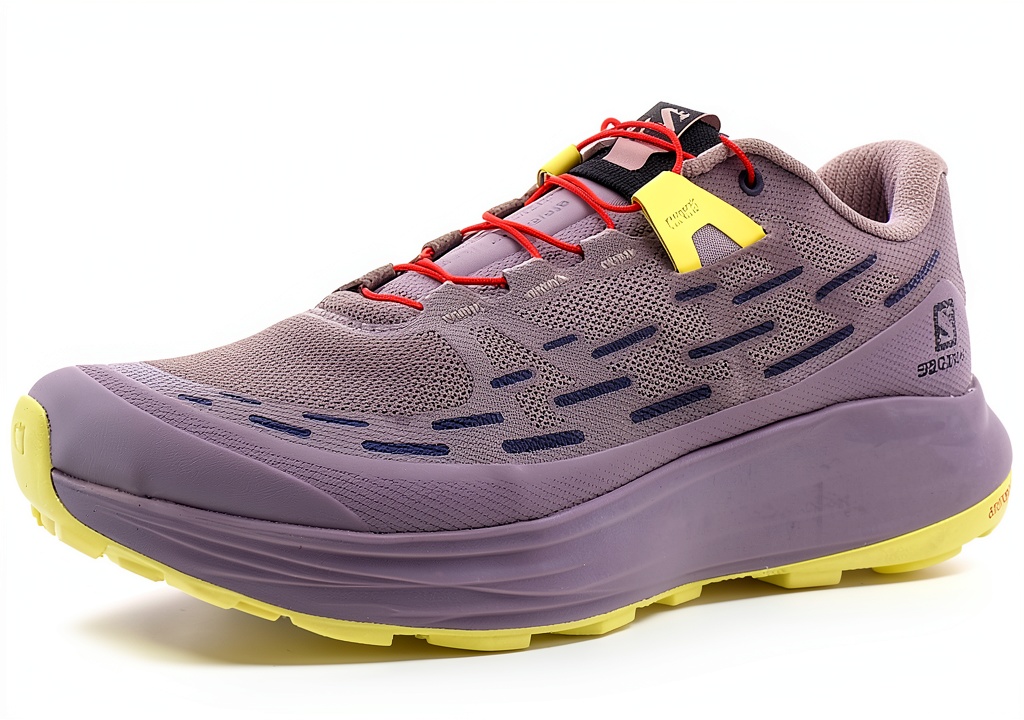 Installing Salomon Women's Running Shoes Size 9.5 Quail Yellow Iris Fiery Red on a wooden desk